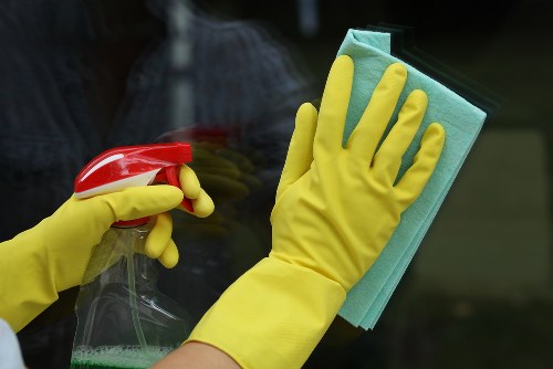 Window cleaner working on a residential property in Lambeth
