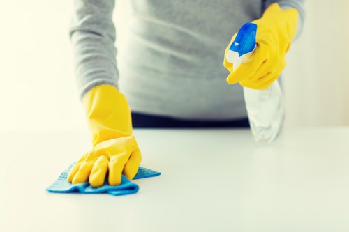 Cleaning team maintaining safe hygiene practices in a workplace