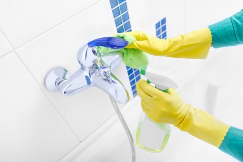 Professional cleaner responding to service issue