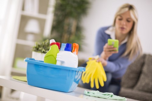 A cleaner working on a mattress in a flat within Lambeth